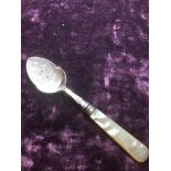 A Sheffield plate jam spoon by J. Round and sons, having a mother of pearl handle and an engraved