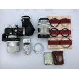 A selection of Leitz/Wetzcar camera lenses and incident light and Leica meter.