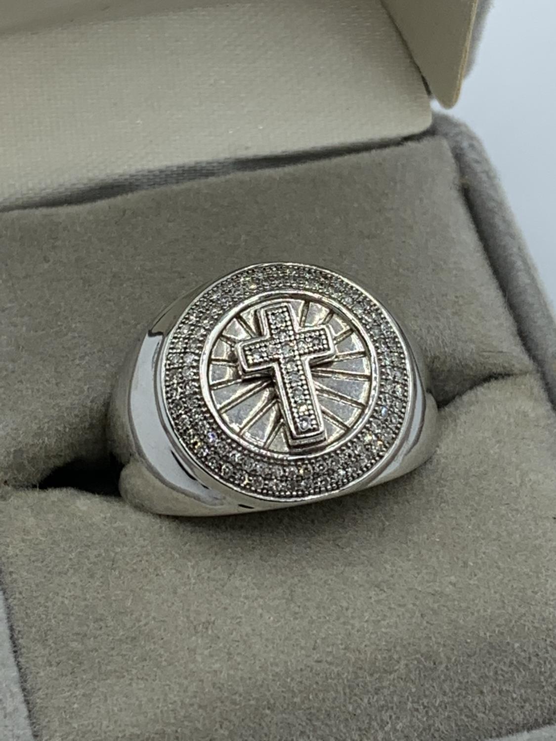 9ct white gold ring with encrusted diamonds forming a cross in the centre and more diamonds surround