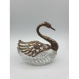 A cut glass sweet dish with silver swan head and pivoting wings, with a weight of 504g.