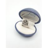 18CT WHITE GOLD DIAMOND CLUSTER RING, SIZE M WEIGHT 6.2G. Hallmark inside the band showing 750 for