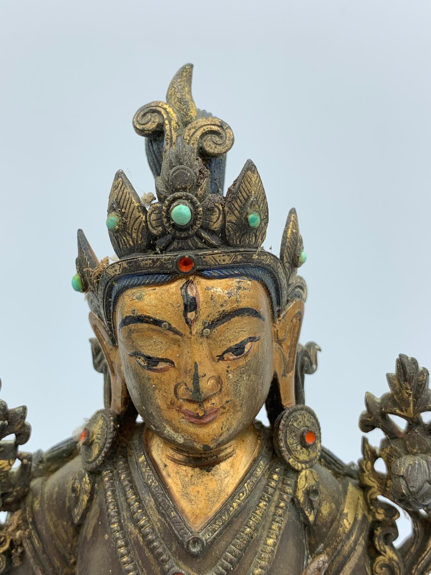 A very early Tibetan religious deity gilt on bronze with turquoise stones and painted dace, weight - Image 5 of 14