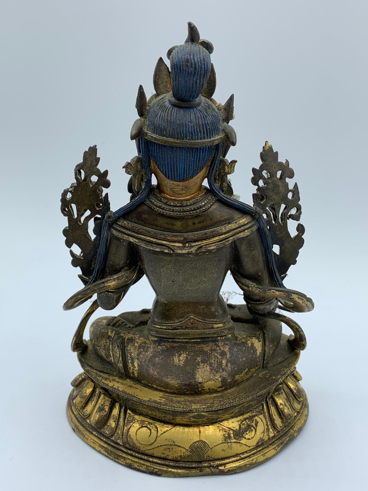 A very early Tibetan religious deity gilt on bronze with turquoise stones and painted dace, weight - Image 7 of 14