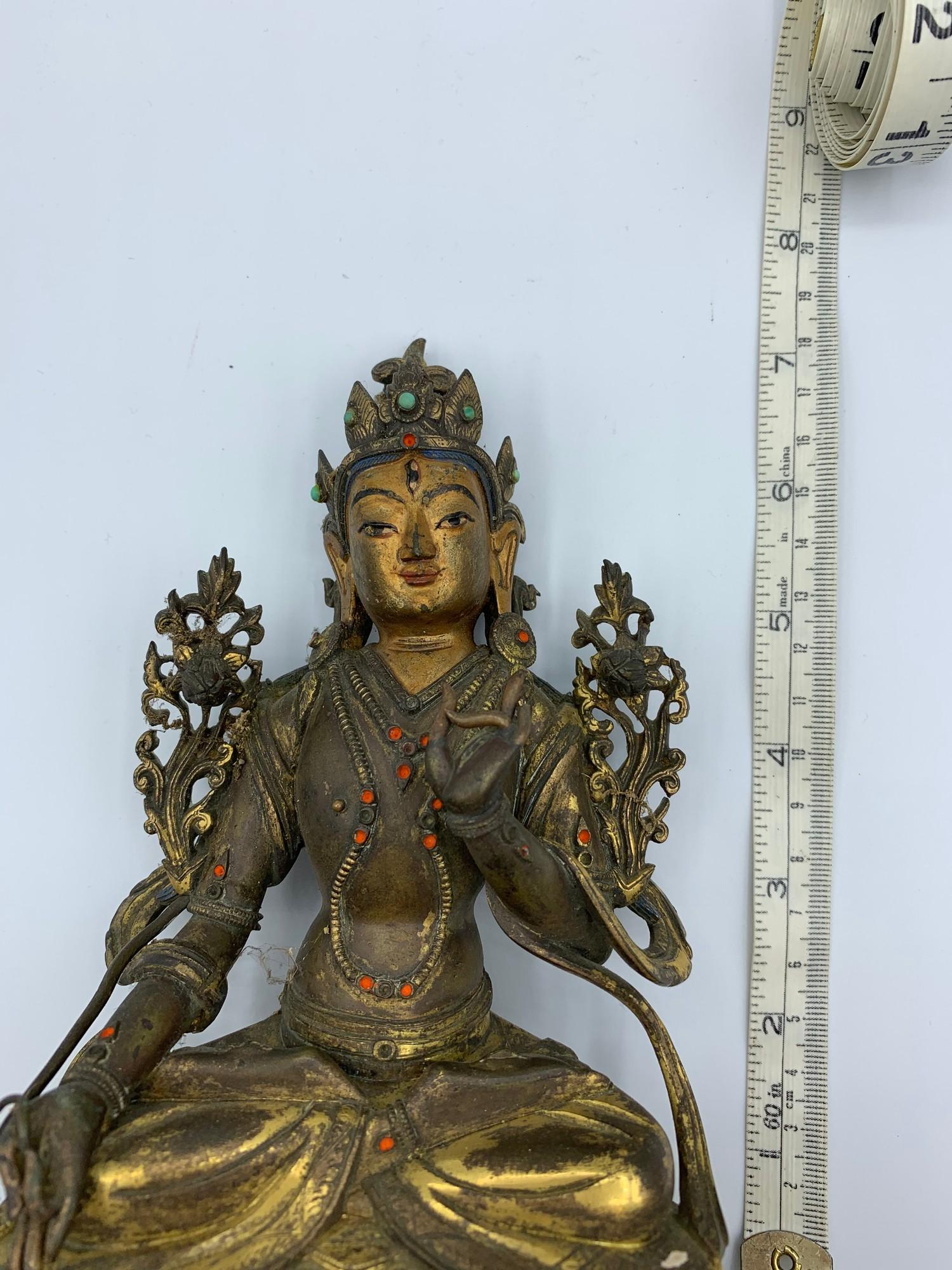 A very early Tibetan religious deity gilt on bronze with turquoise stones and painted dace, weight - Image 13 of 14