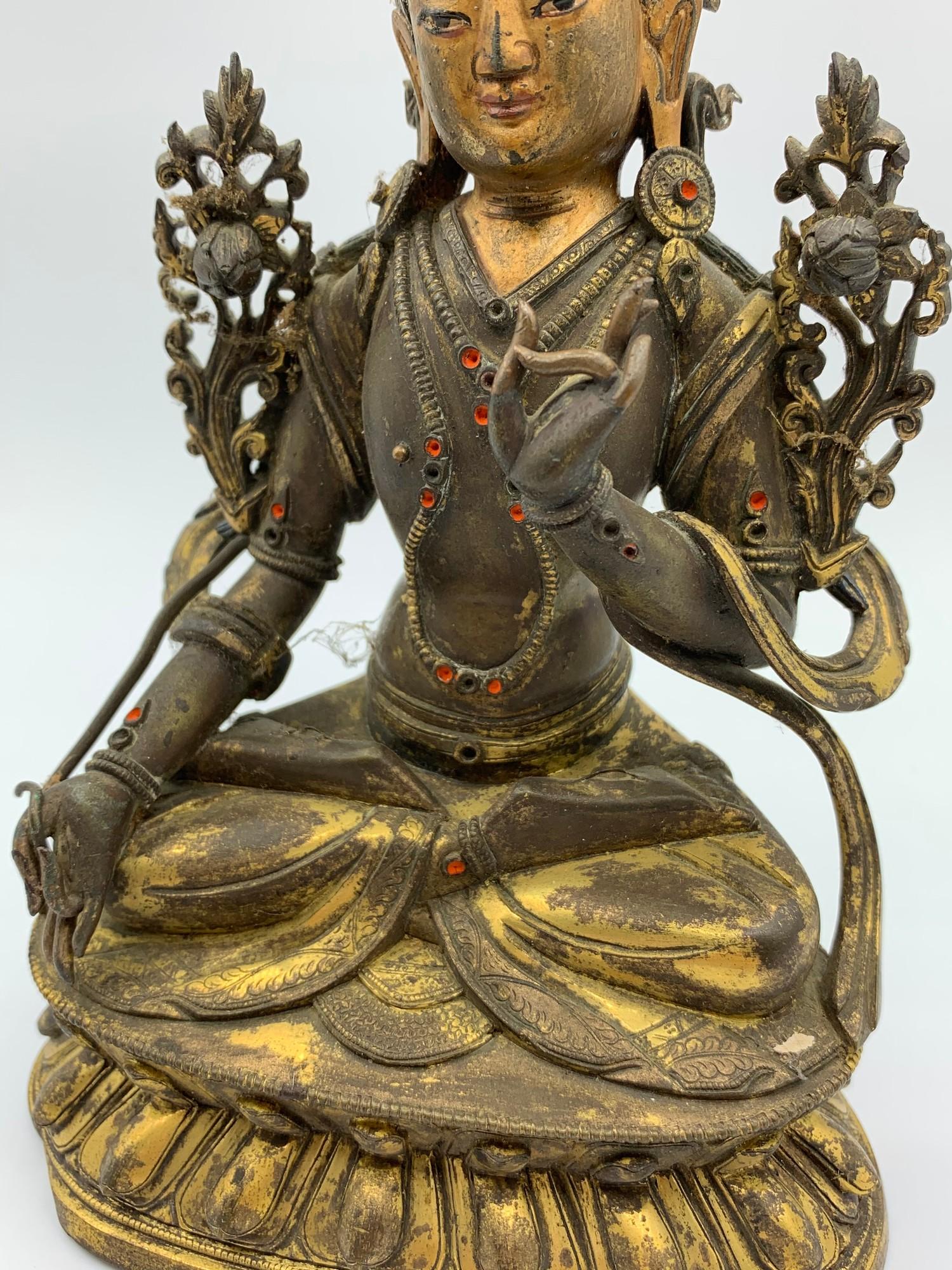 A very early Tibetan religious deity gilt on bronze with turquoise stones and painted dace, weight - Image 10 of 14