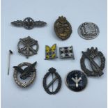 An assortment of 10x German WWII badges