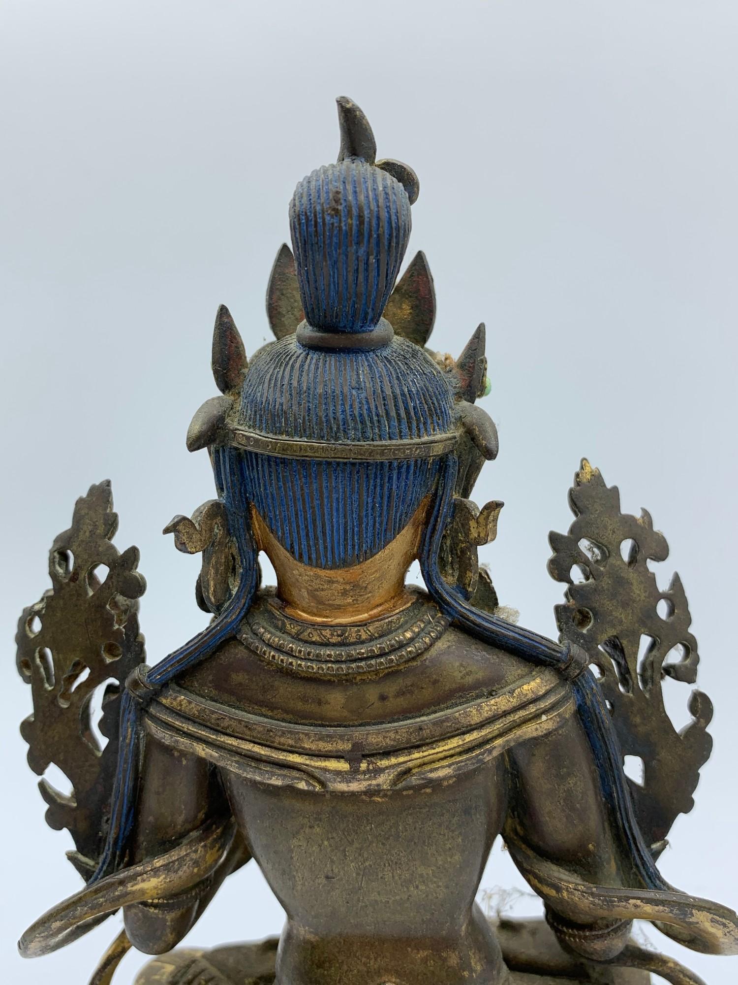 A very early Tibetan religious deity gilt on bronze with turquoise stones and painted dace, weight - Image 9 of 14