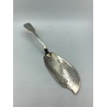 Victorian silver fish slice, the weight being 131g.