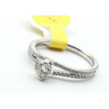 18ct white gold ring with diamond encrusted shoulders and a 0.31ct solitaire centre stone (J