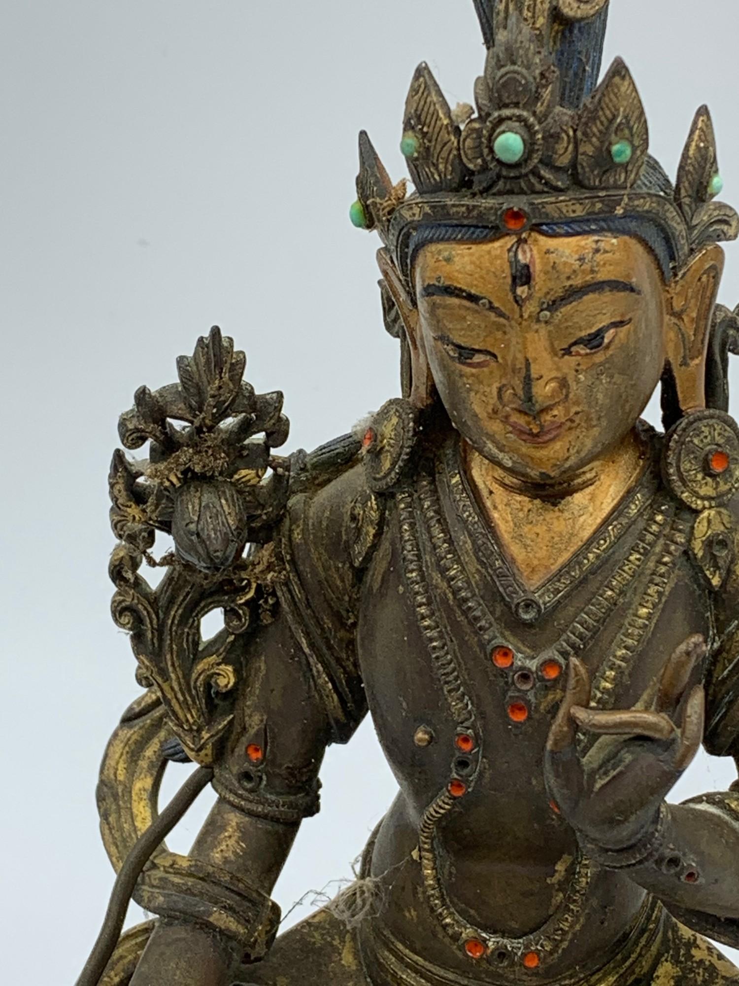 A very early Tibetan religious deity gilt on bronze with turquoise stones and painted dace, weight - Image 3 of 14