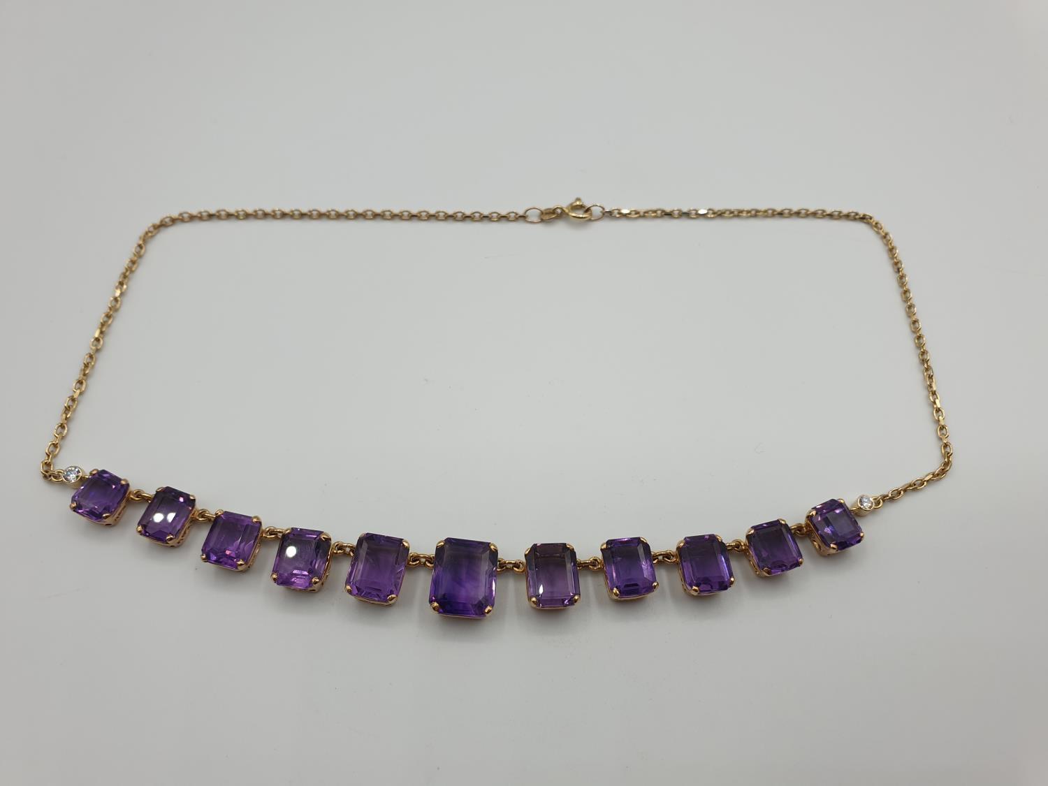 9CT YELLOW GOLD AMETHYST NECKLACE, Size of the biggest stone is 11 x 9mm .WEIGHT 15.8G AND 40CM