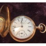 Antique ladies gold full hunter pocket watch, having engine turned design with floral work to both