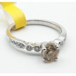 18ct white gold ring with 0.74ct diamonds and cognac centre stone, weight 3.3g and size N