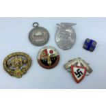 An interesting selection of 6x WWI and WWII badges and coins (replicas)