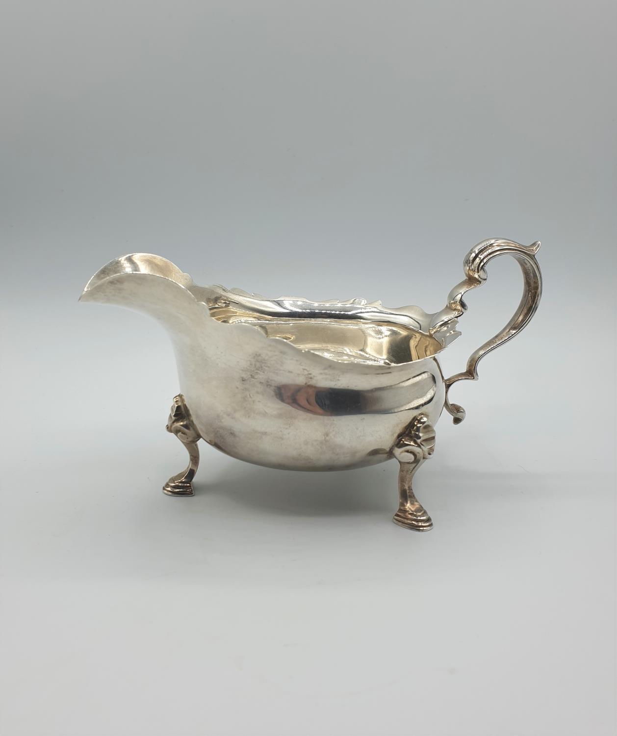 Antique Silver Sauce/ Gravy boat with three cabriole legs and having an unusual scale design to - Image 5 of 5