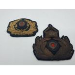 2 German world war II gold cap hat badges.