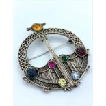 Celtic silver brooch with brightly coloured stones, weight 25.2g and 5cm long