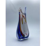 A vase in the shape of a female figure, dated 1998 and signed Mila Rose. Mainly blue colouring