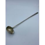 Vintage white metal hot toddy ladle. Having a pouring lip to bowl and a barley twist handle.