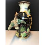 A 19th century French ceramic vase, highly decorative