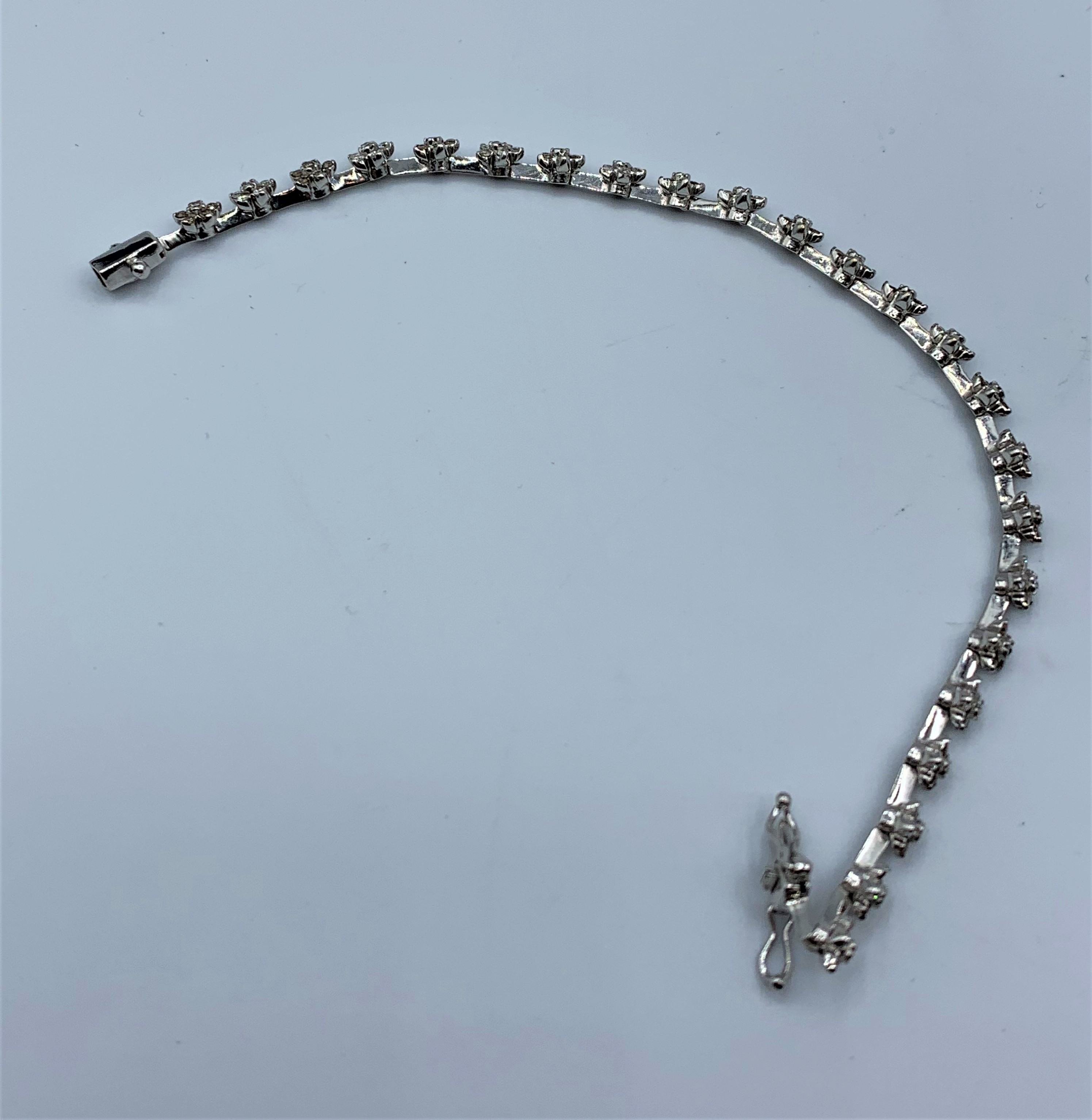 18CT WHITE GOLD DIAMOND SET FLOWER BRACELET APPROX 1.50CT 11G - Image 2 of 4