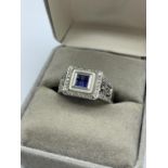 18ct white gold ring with blue stones centre and encrusted diamonds surround WITHDRAW