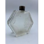 An art deco scent bottle with embossed face on front (missing stopper) 13cm high 12.5cm wide