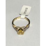 9k GOLD RING WITH CZ AND YELLOW SAPPHIRE (1.56CT) FROM SRI LANKA OVAL CUR, WEIGHT 2.4G AND SIZE O1/2