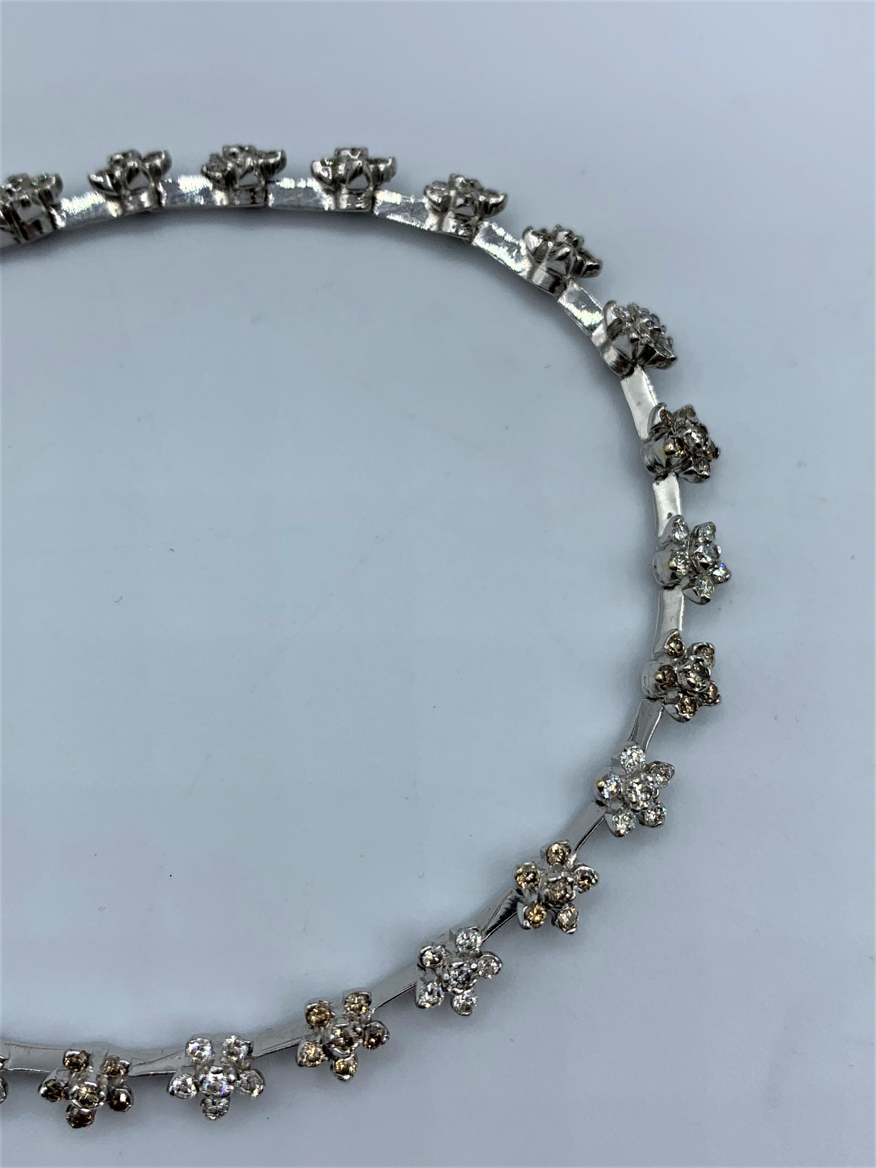 18CT WHITE GOLD DIAMOND SET FLOWER BRACELET APPROX 1.50CT 11G