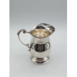 A silver jug made in Sheffield in 1920. The weight is 135g