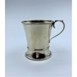 A silver jug hallmarked silver Birmingham. The height is 7cm and the circumference is 6.5 cm.