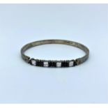 Silver bangle with jet and CZ stones, weight 11g and 20cm width