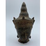 An oriental Buddhist head in bronze, circa 1650. Which weighs 355g and has a height of 12cm.