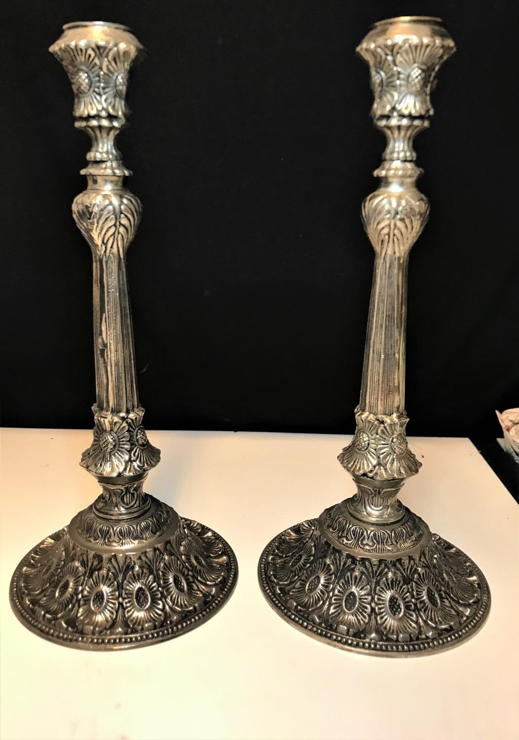 A pair of large ornate silver plate candlesticks circa 1930, with a weight of 5.7kg