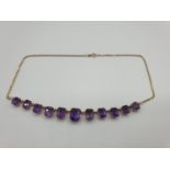 9CT YELLOW GOLD AMETHYST NECKLACE,largest stone is 11 x 9mm .WEIGHT 15.8G AND 40CM LENGTH.