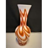 Large orange and milk glass vase with striking design. 36cms high.