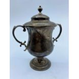 Silver sports cup with lid. The weight is 148g and is 12.5cms high.