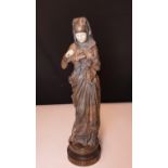 A bronze & ivory figure of 'Liseuse' by A. Carrier Belleuse. One hand missing, the other slightly