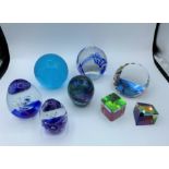 8 selection of assorted paperweights.