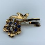 Sapphire and diamond (approx 0.65ct) brooch set in 18ct white and rose gold, in a form of flowers,