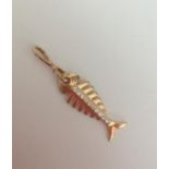 14ct gold dainty fish pendant with a centre line of clear stones, weight 1.5g and 3.75cm long