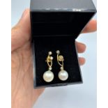 Pair of 18ct gold pearl and diamond drop earrings (0.60ct), weight 4g approx