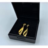 A pair of 9ct yellow gold drop earrings