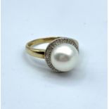 9ct yellow gold ring with pearl centre and encrusted diamond surround, weight 3.5g and size N/O