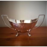 Vintage twin handled silver sugar bowl, having patterned engraving to upper border, standing on four