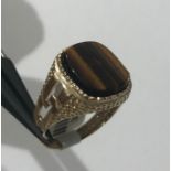 9k yellow gold ring with tiger eye stone (13x 11mm cushion), weight 5.2g and size R1/2 (ECN599)