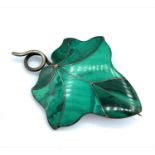 An unusual silver brooch/pendant with green Malachite panels leaf shape. The weight is 26g.