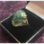 9ct gold stone set ring, having a green moss agate in a four gold claw setting, clear hallmark for
