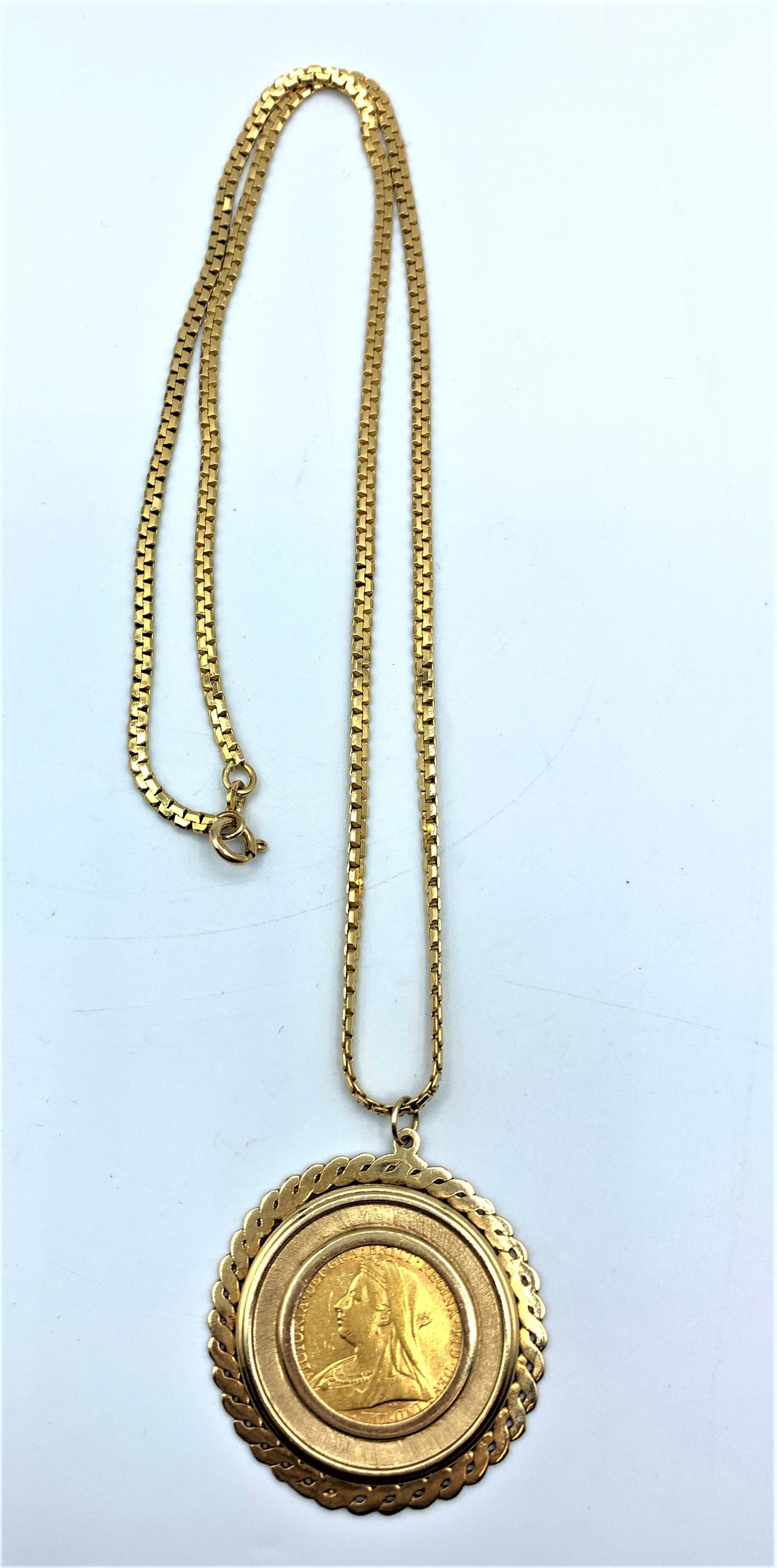 Sovereign pendant set in 9ct chain. The total weight is 28g and the chain is 34cm length .