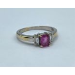 18ct gold ring with emerald cut pink sapphire with diamond baguette shoulders, weight 3.2g and